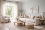 High end living room in muted duck egg blue and pale blue grey tones, showcasing color psychology where soft blue hues promote calm, emotional balance, and stress reduction, paired with neutral textures and natural light for a restorative atmosphere